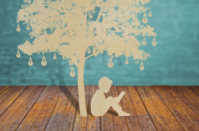 14944122 - paper cut of children read a book under tree of bulb
